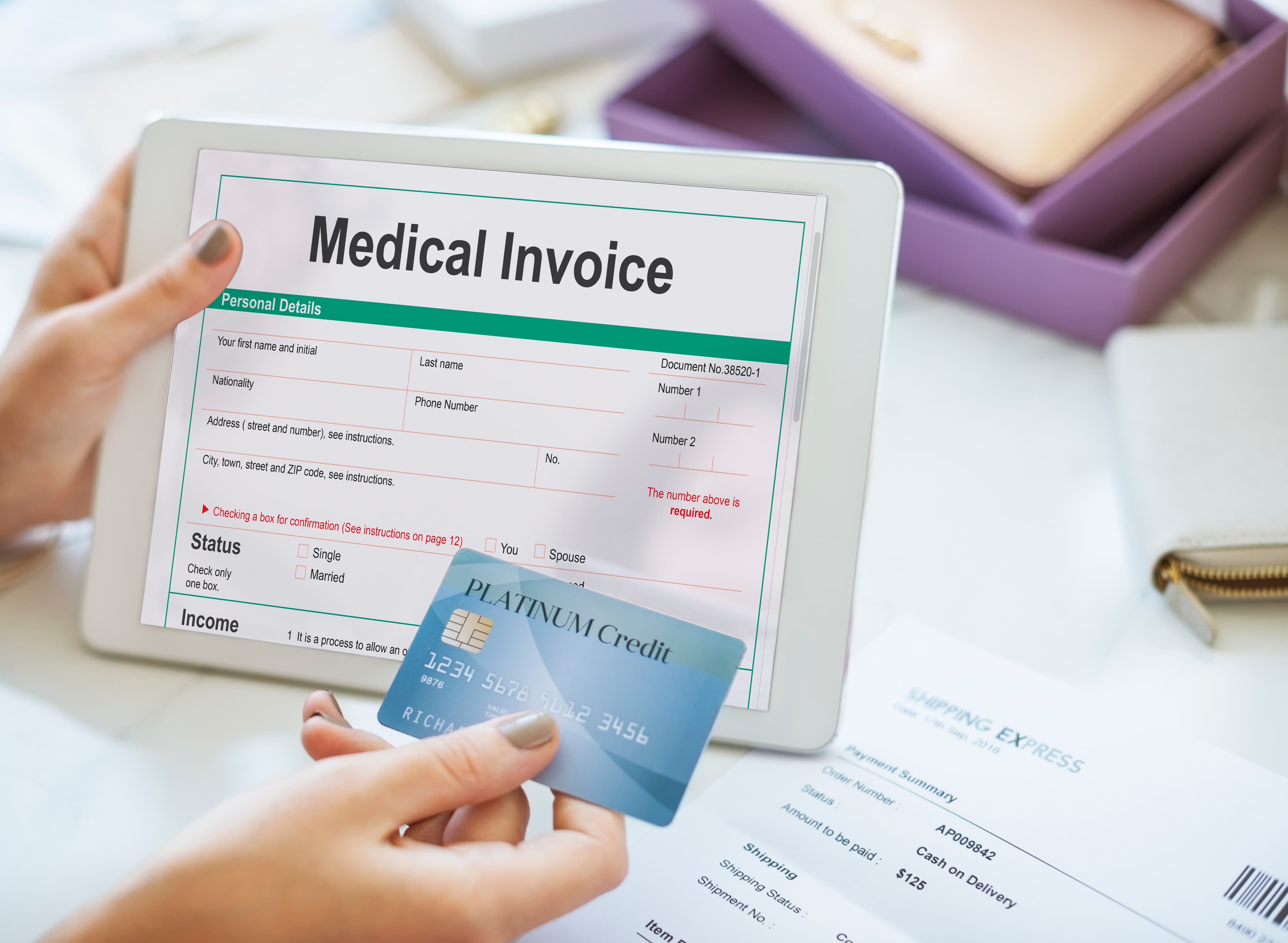 Reviewing a medical invoice and payment on a tablet